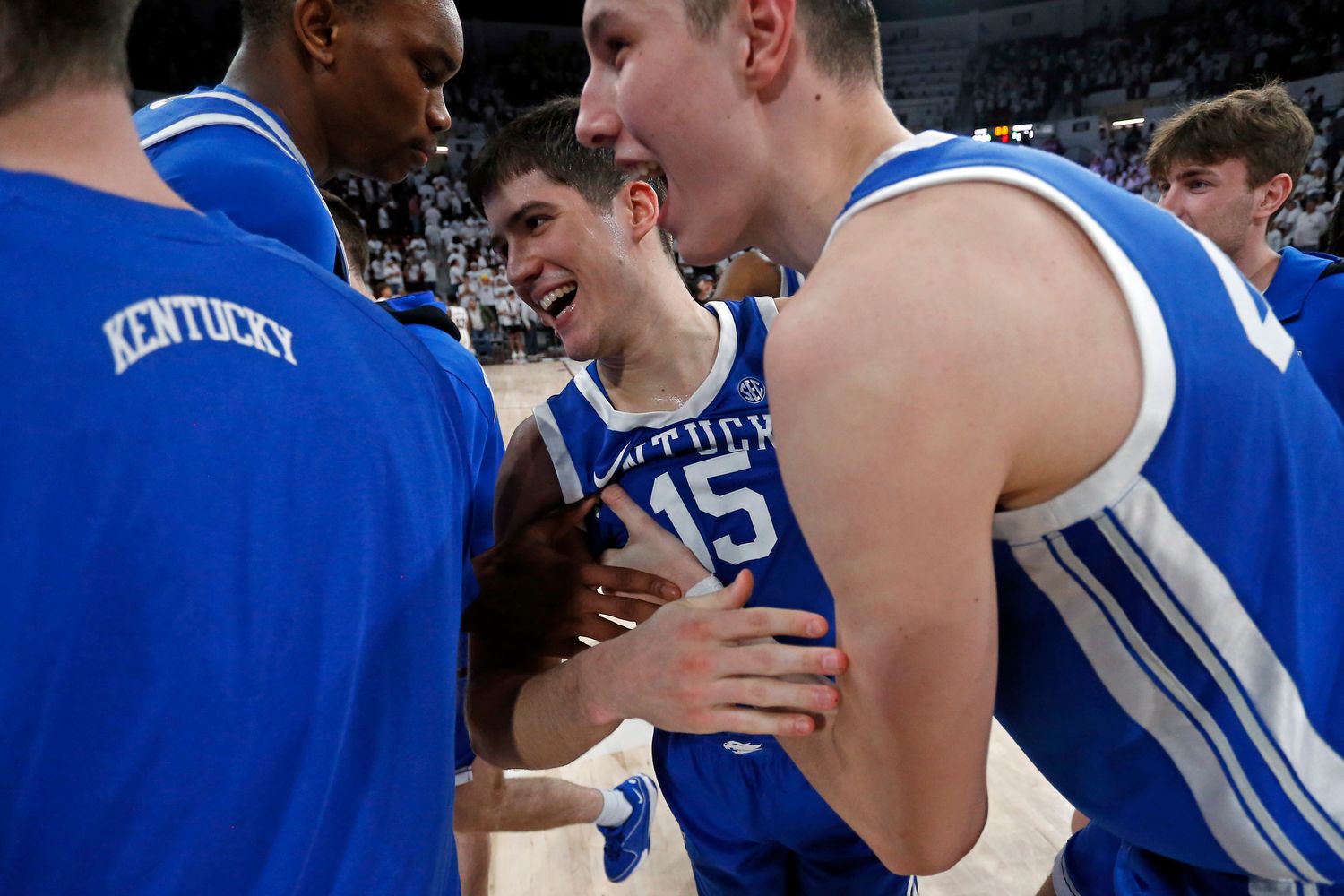 Feb 27, 2024; Starkville, Mississippi, USA; Kentucky Wildcats forward Ugonna Onyenso (33) and forward Zvonimir Ivisic (44) celebrate with guard Reed Sheppard (15) after defeating the Mississippi State Bulldogs at Humphrey Coliseum. Mandatory Credit: Petre Thomas-USA TODAY Sports